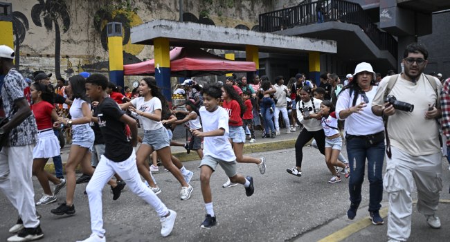 People run into a street following an earthquake in Caracas on June 24 2026