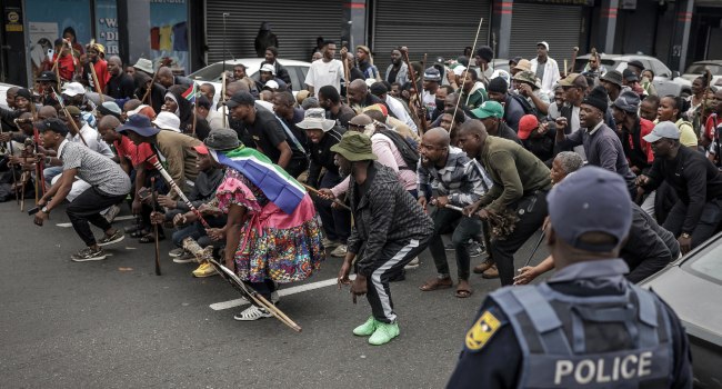 Protesters gesture and chant slogans during a demonstration by members of the March and March move
