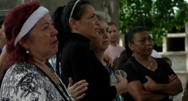 Relatives of victims of the June 24 twin earthquakes pay last respects during their burial at the Cementerio General del Sur (Southern General Cemetery) in Caracas on June 29, 2026