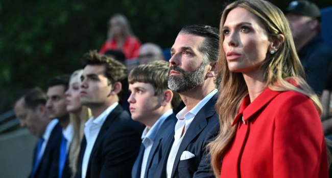 Donald Trump Jr. and his wife, Bettina Anderson, wait to hear US President Donald Trump deliver remarks during the Independence Day events at Mount Rushmore National Memorial in Keystone, South Dakota, July 3, 2026