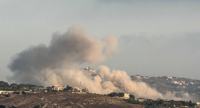A photograph taken from the southern Lebanese city of Nabatieh shows smoke rising from the site of a